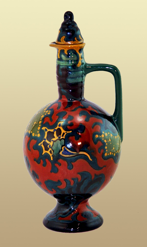 Nr.: 200, Te koop aangeboden sieraardewerk van Flambe Gouda  Plateel kruikje + stop, Hoog 27 cm , Diameter 12,5 cm , Jaar 1918